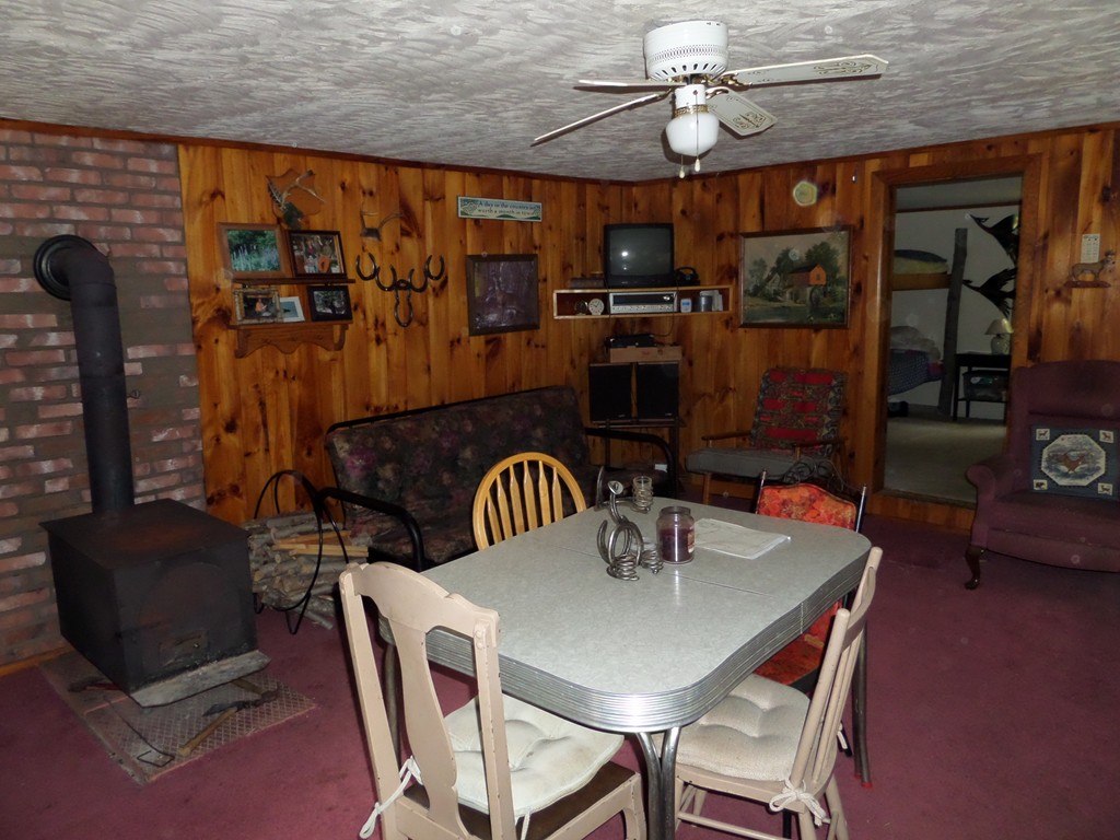319 Harvey Road Worthington, MA 01098 - Photo 17 of 19 a view of a dining room with furniture and chandelier