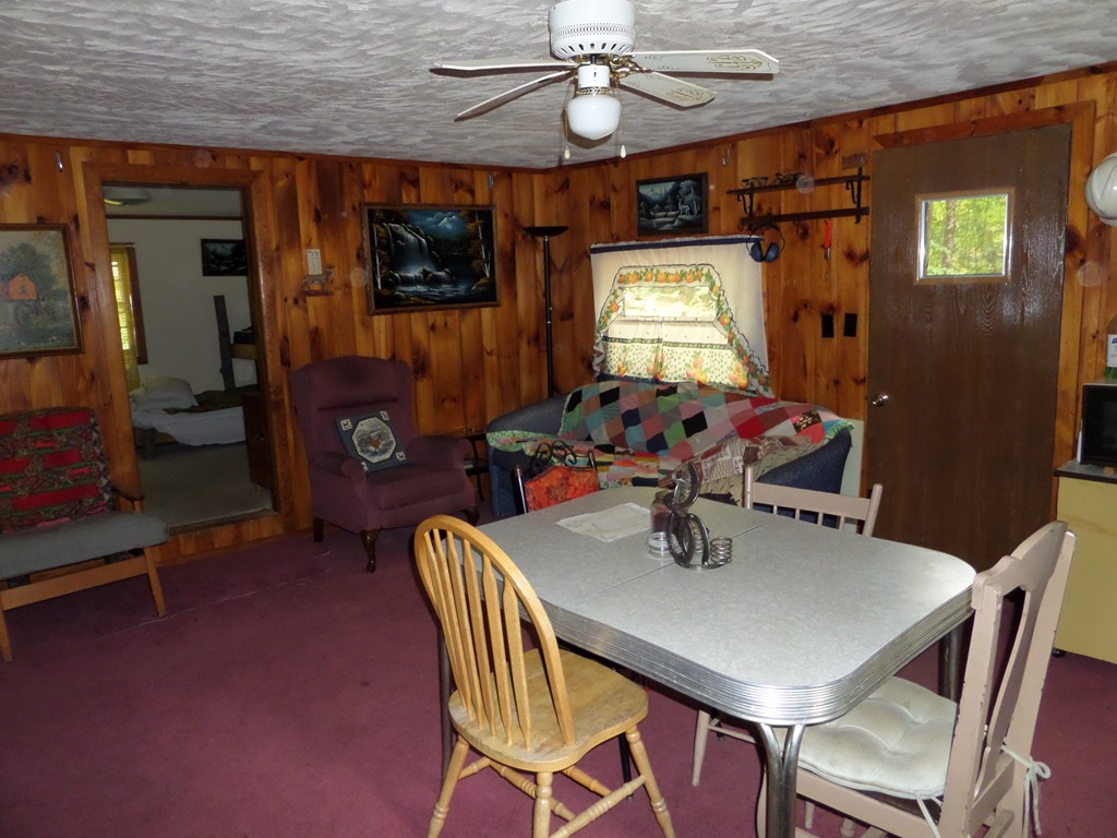 319 Harvey Road Worthington, MA 01098 - Photo 18 of 19 a view of a dining room with furniture and chandelier