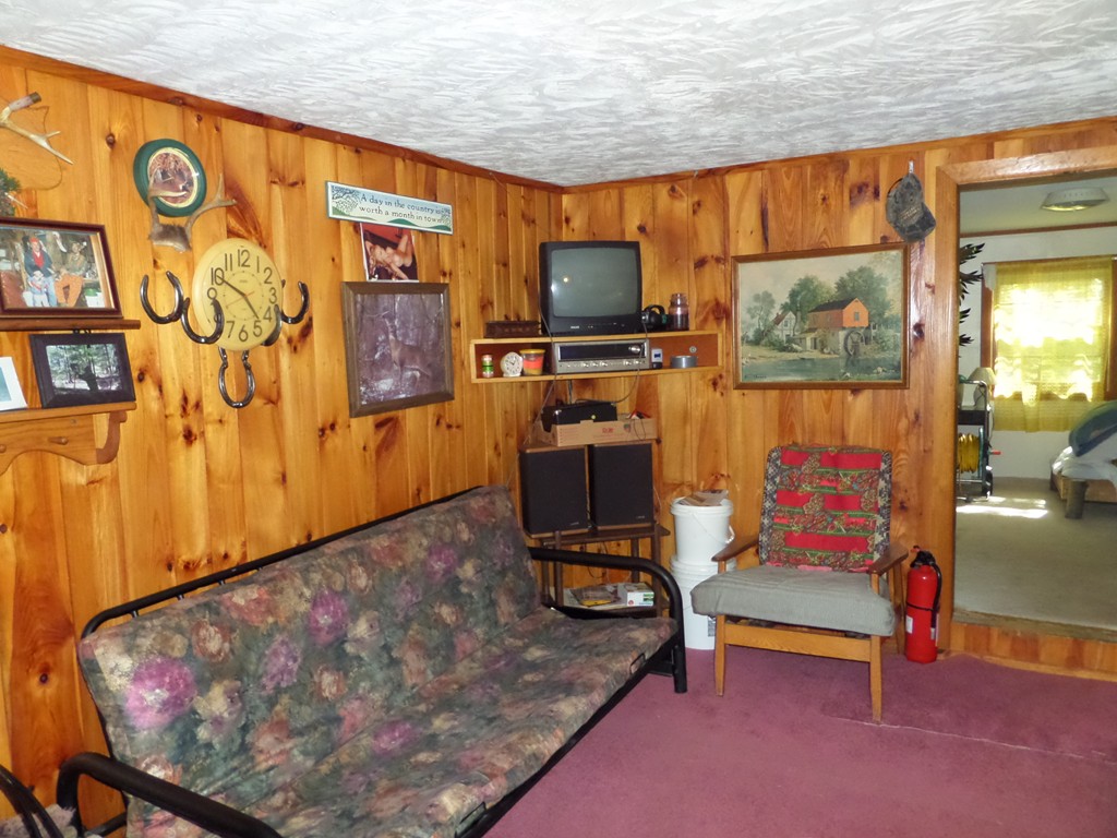319 Harvey Road Worthington, MA 01098 - Photo 8 of 19 a living room with furniture and a flat screen tv