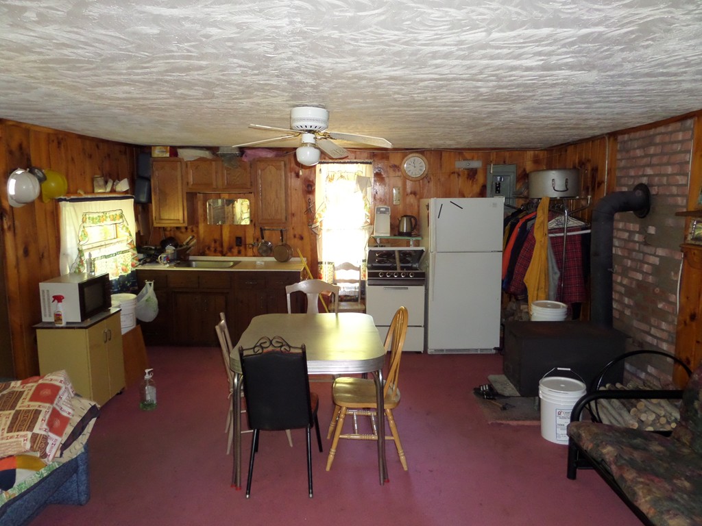 319 Harvey Road Worthington, MA 01098 - Photo 10 of 19 a dining room with furniture and window
