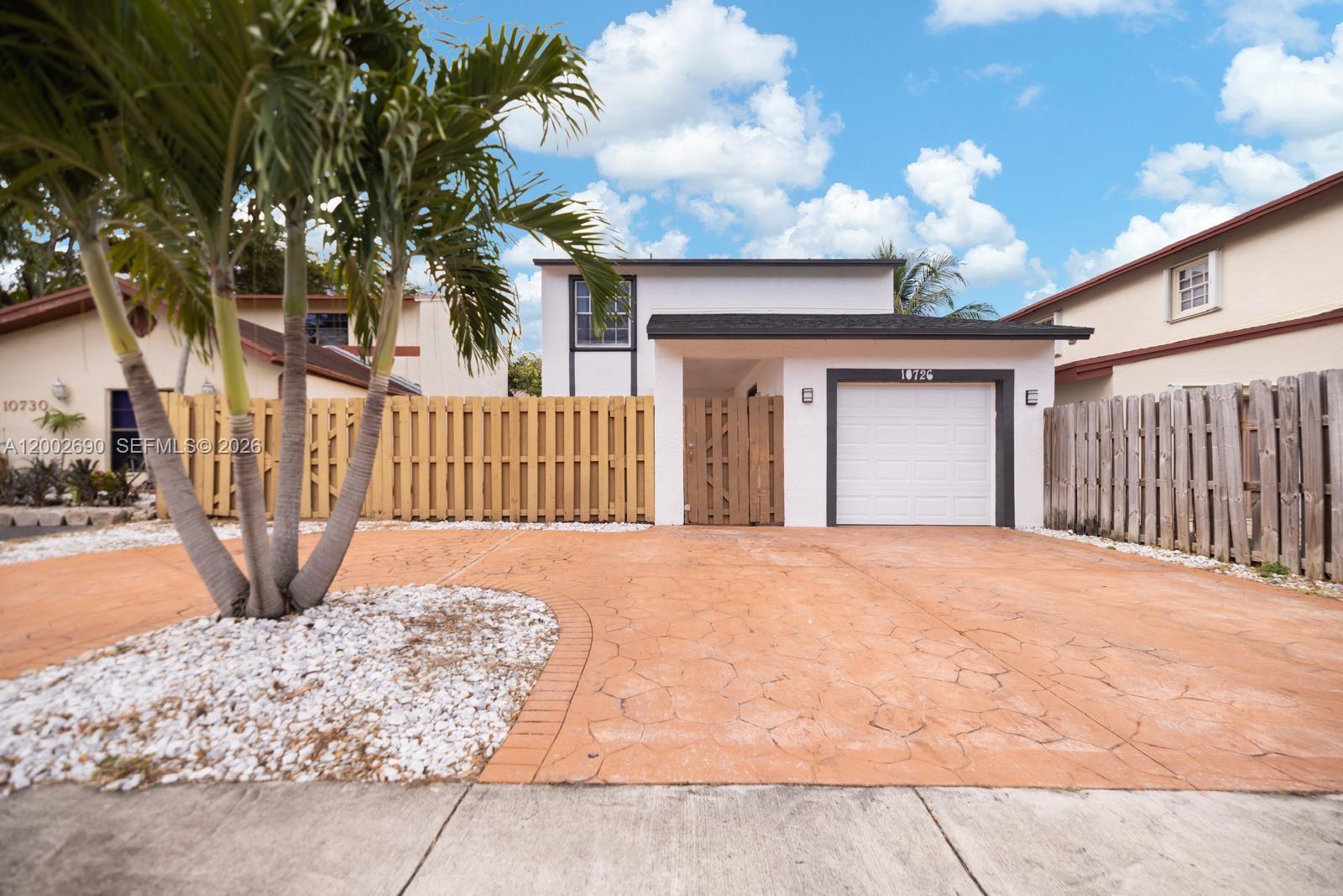 10726 Southwest 147th Court Miami, FL 33196 - Photo 1 of 23 a view of backyard of a house