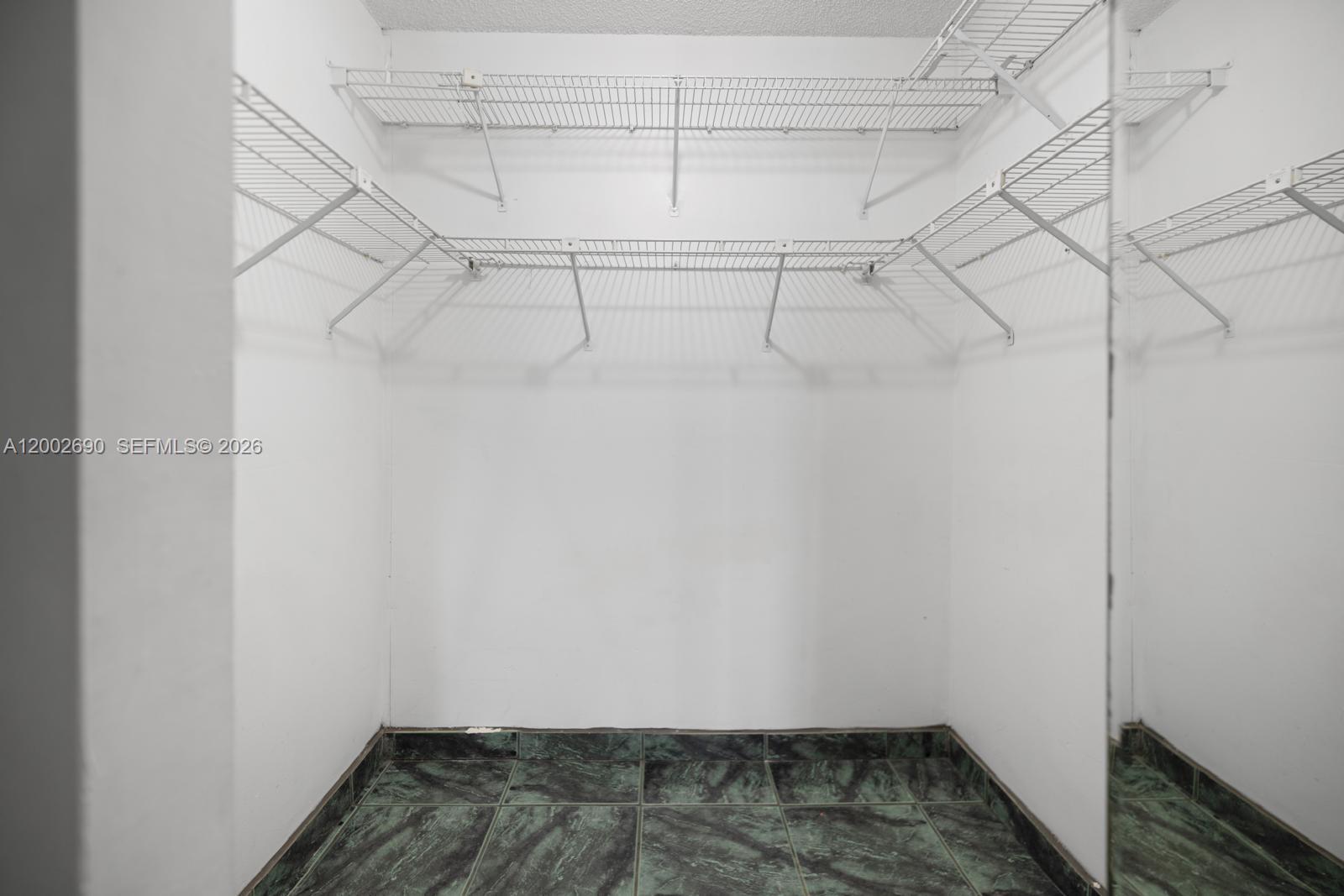 10726 Southwest 147th Court Miami, FL 33196 - Photo 11 of 23 a view of a room with racks on the wall