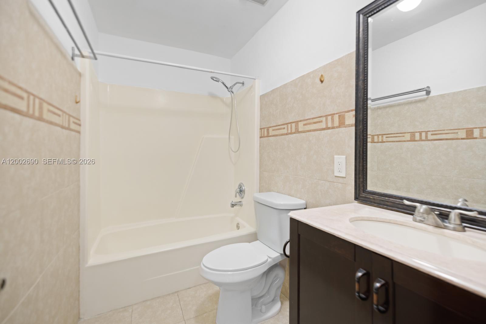 10726 Southwest 147th Court Miami, FL 33196 - Photo 16 of 23 a bathroom with a sink toilet and shower