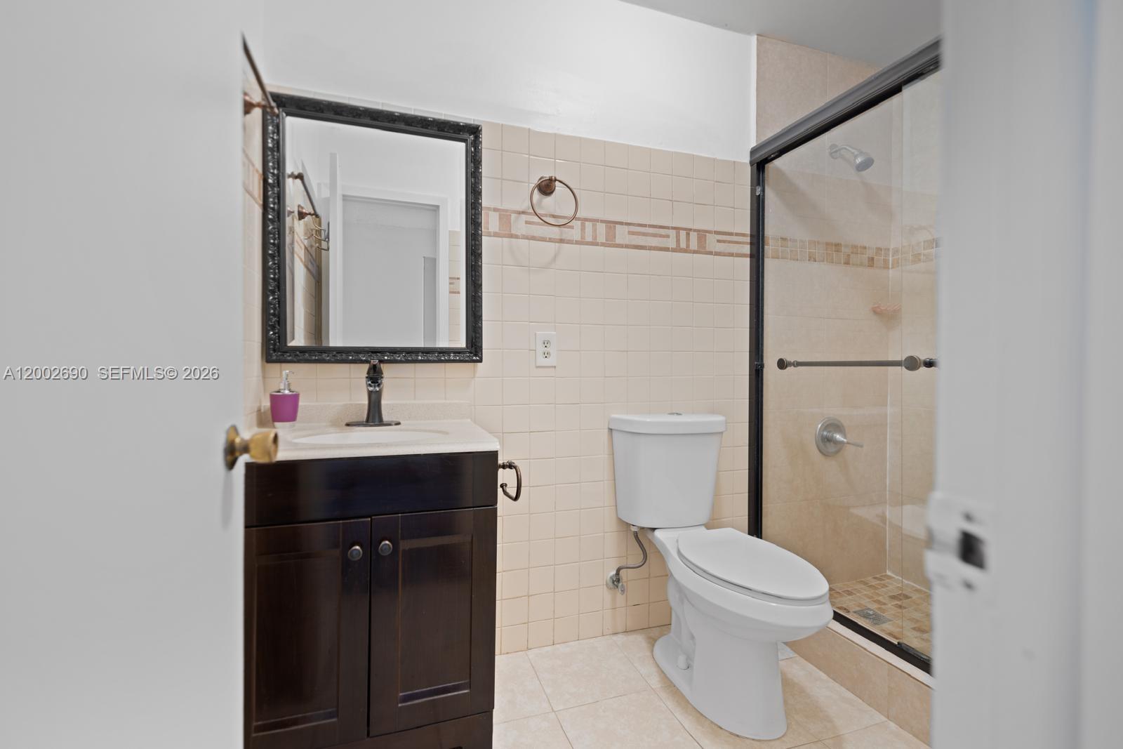 10726 Southwest 147th Court Miami, FL 33196 - Photo 17 of 23 a bathroom with a sink toilet and shower