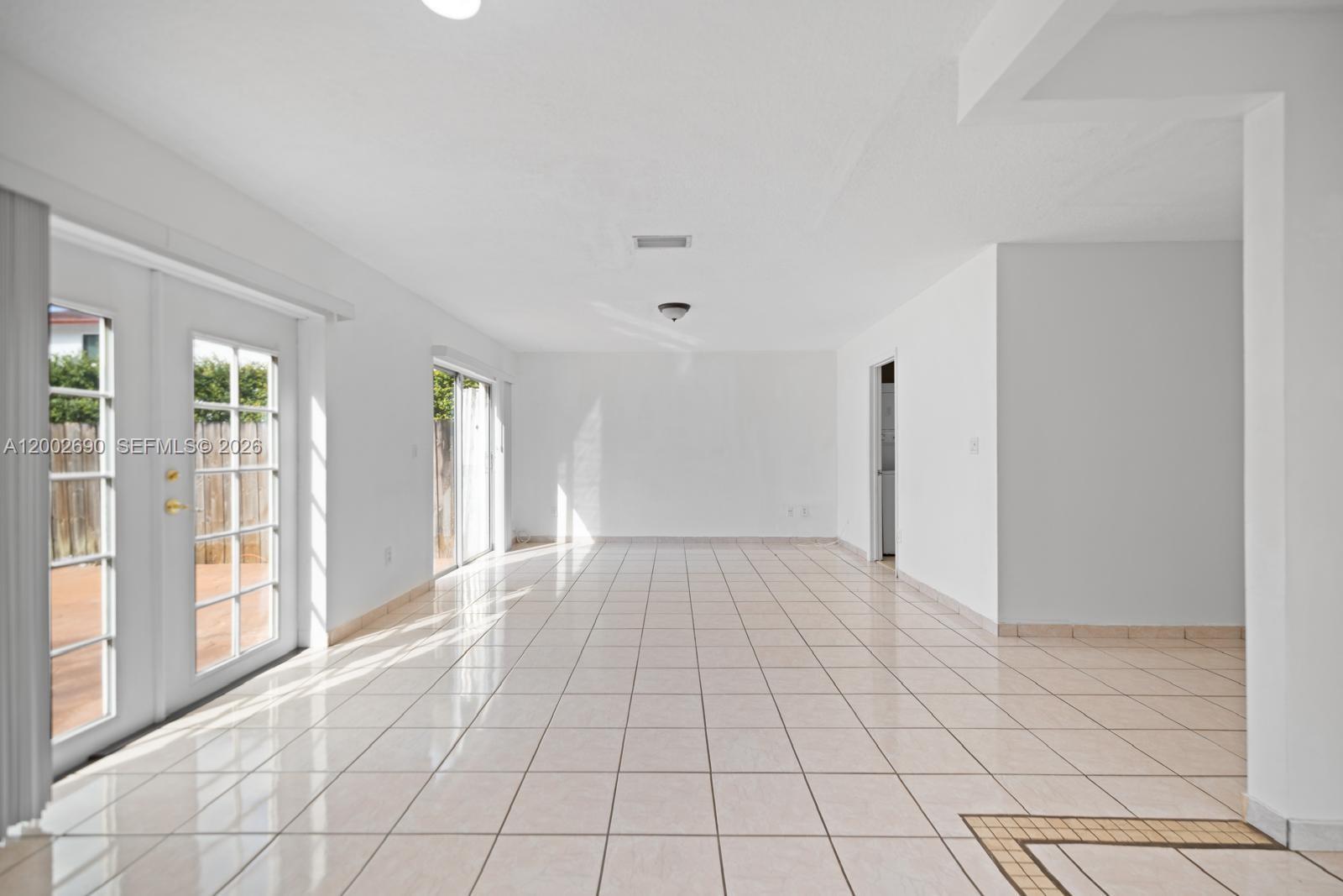 10726 Southwest 147th Court Miami, FL 33196 - Photo 5 of 23 a view of an empty room with window