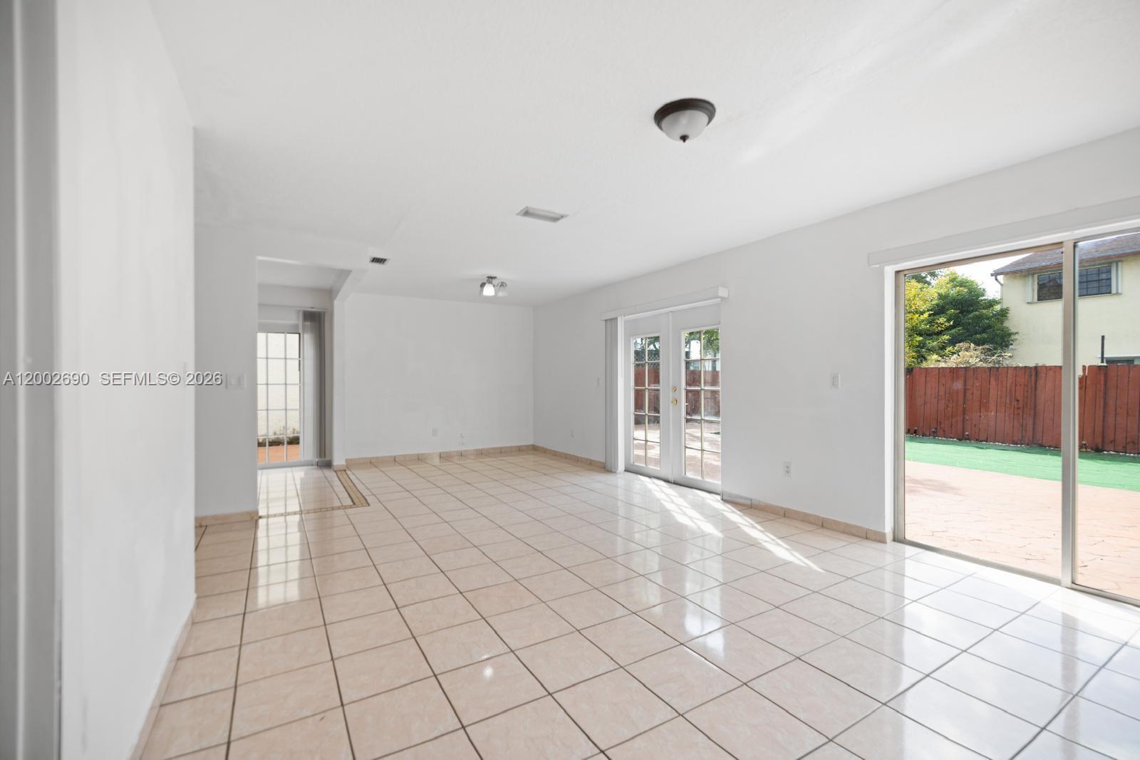 10726 Southwest 147th Court Miami, FL 33196 - Photo 6 of 23 a view of an empty room and window