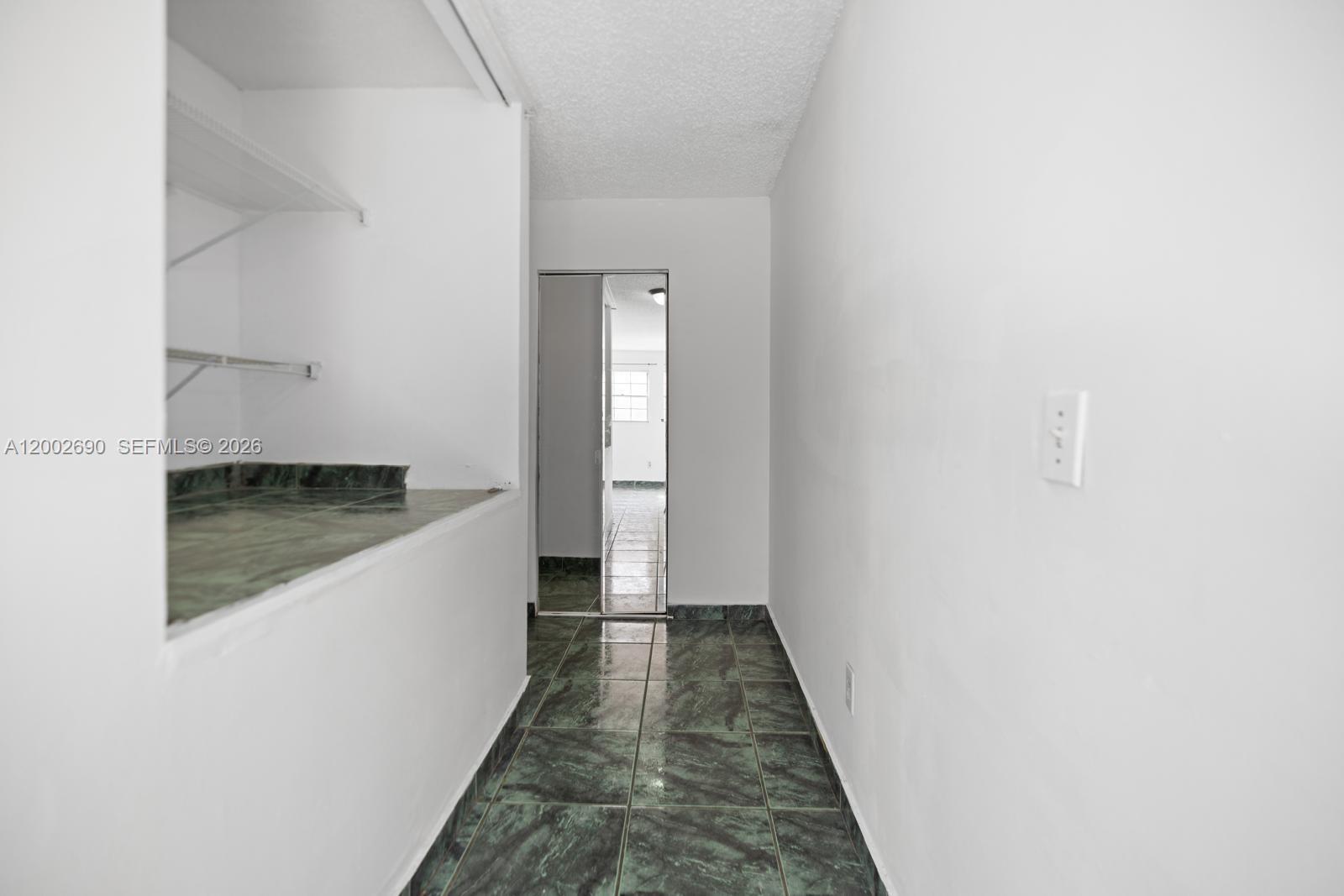 10726 Southwest 147th Court Miami, FL 33196 - Photo 10 of 23 a view of a hallway with wooden floor and staircase