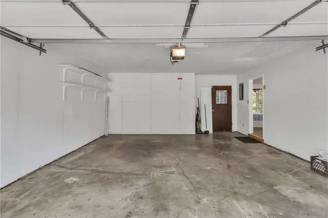 a view of a big room with a ceiling fan