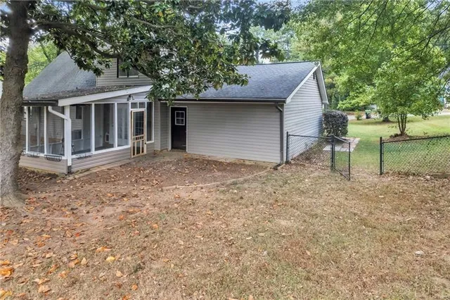 a house with trees in the background