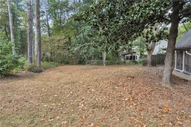 a backyard of a house with lots of green space