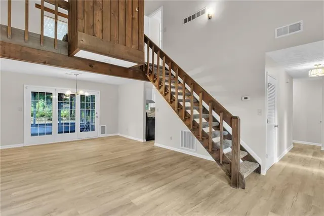 a view of an entryway with wooden floor
