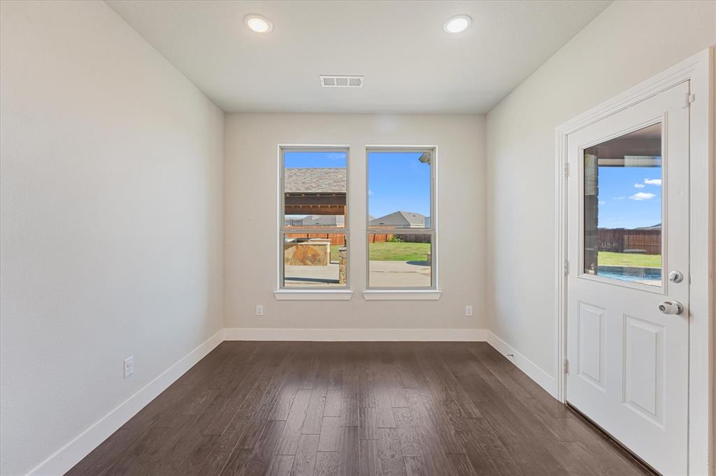 2044 Longbridge Road Forney, TX 75126 - Photo 12 of 40 Recessed ceiling lighting, two windows, wood-finish flooring, and a glass-paneled exterior door