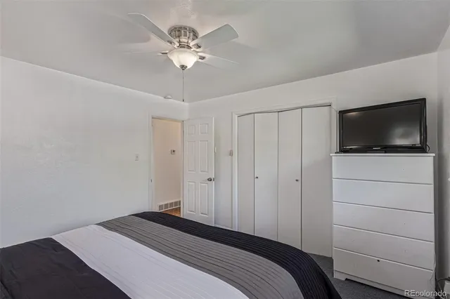 a large white bed in a white room