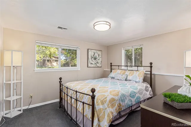 a view of workspace with wooden floor windows