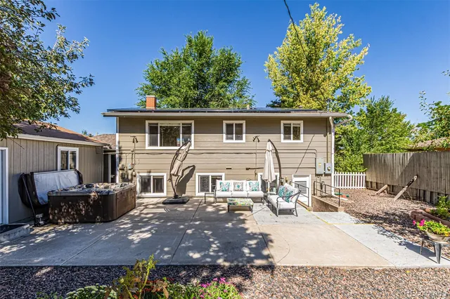 a front view of house with yard outdoor seating and green space