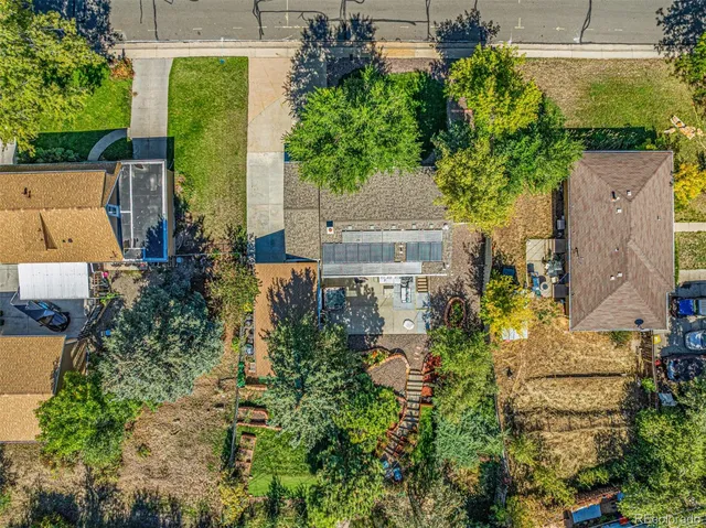 an aerial view of a house with a yard