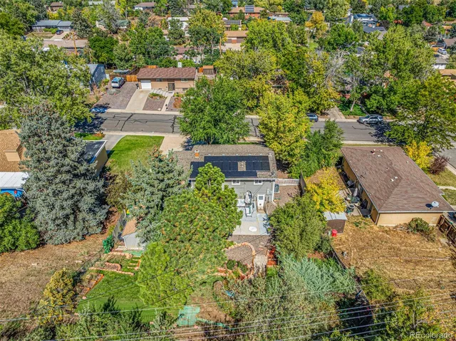 aerial view of a house with garden and patio