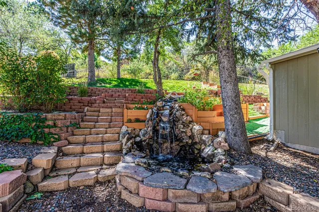 a view of a backyard with sitting area