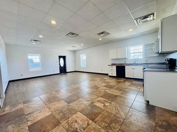 a view of a kitchen with a sink and cabinets