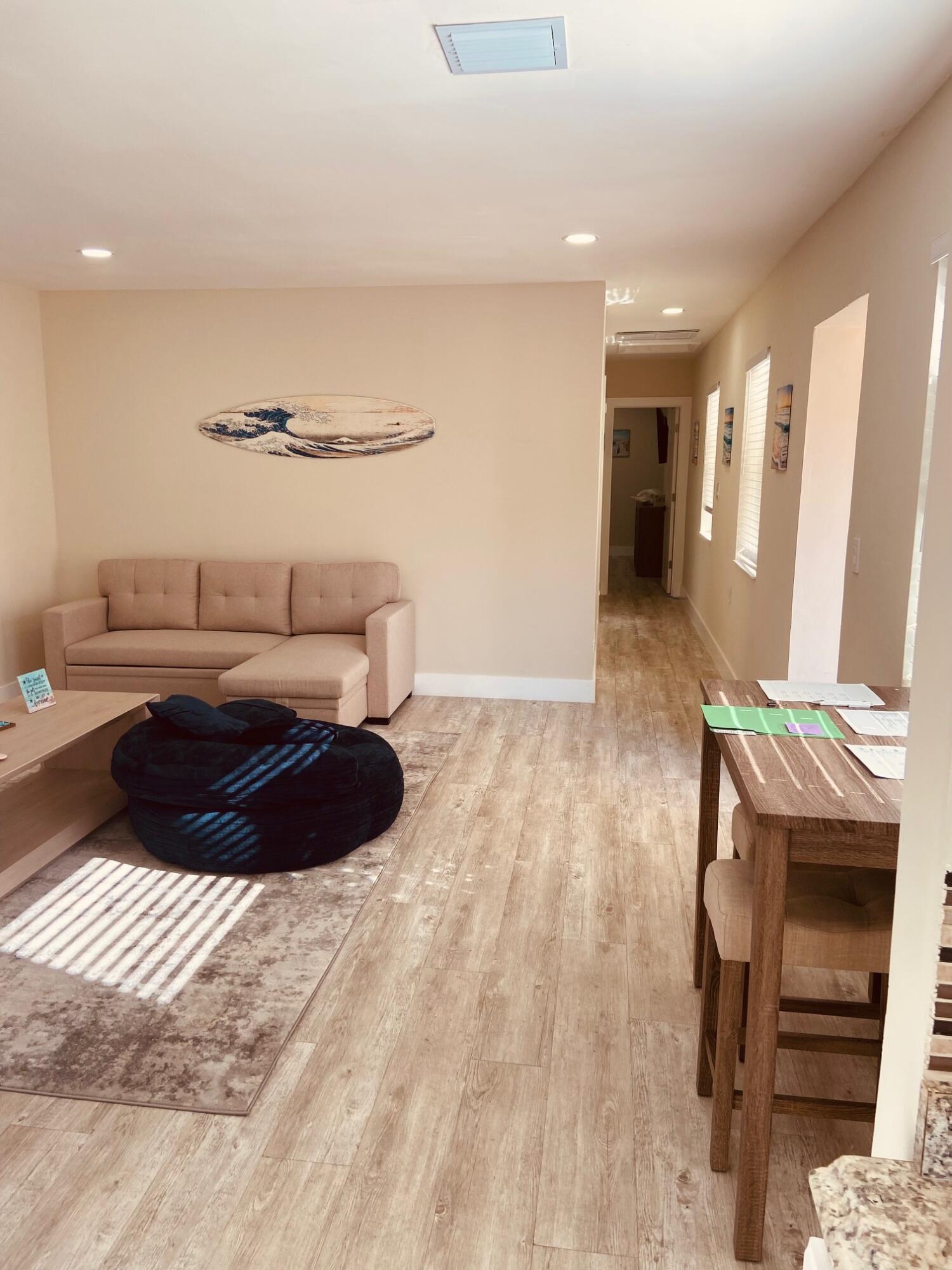 615 Northeast 2nd Avenue Delray Beach, FL 33444 - Photo 13 of 35 a bedroom with a bed and a chair