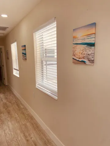 a bathroom with a sink a mirror and shower
