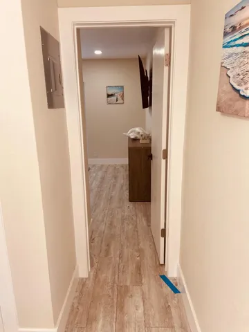 a backyard of a house with wooden floor and fence