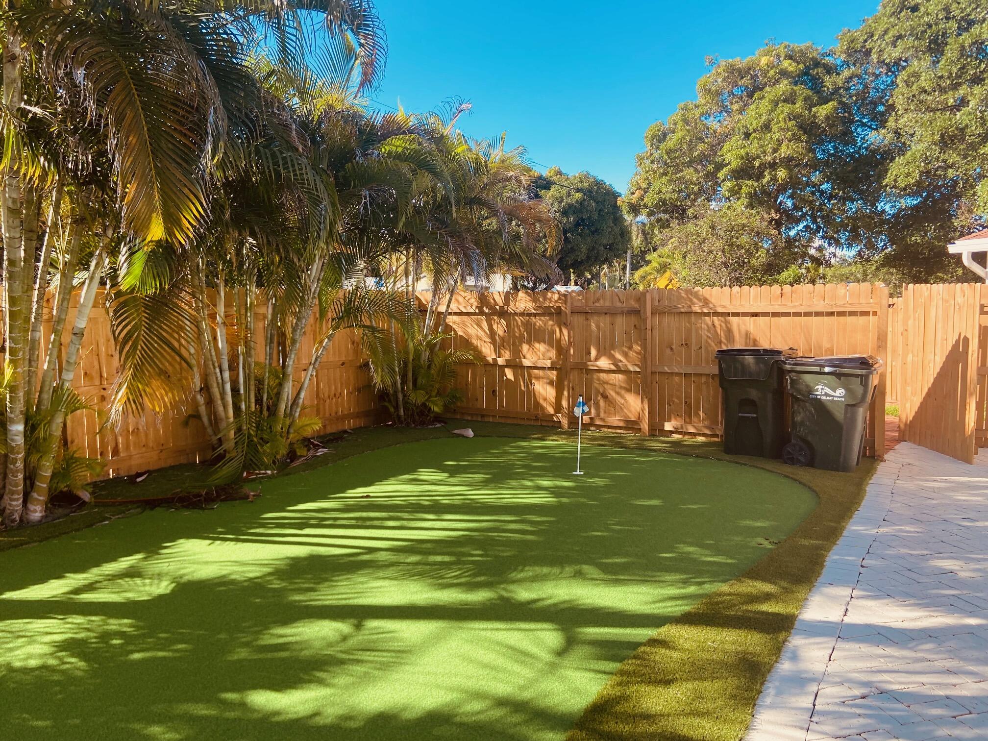 615 Northeast 2nd Avenue Delray Beach, FL 33444 - Photo 31 of 35 a backyard of a house with lots of green space