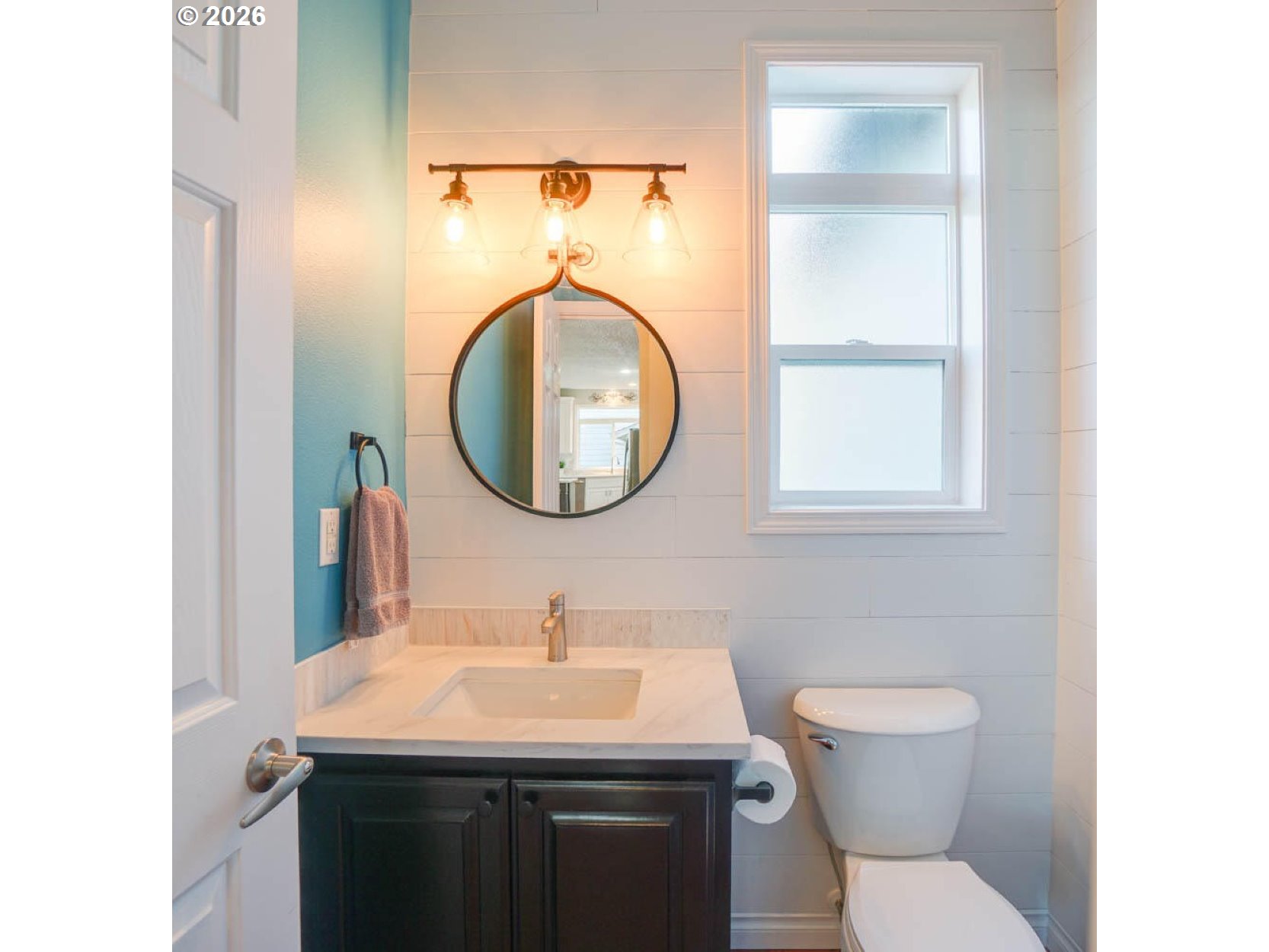 1612 North Heron Drive Ridgefield, WA 98642 - Photo 11 of 33 a bathroom with a sink and a mirror
