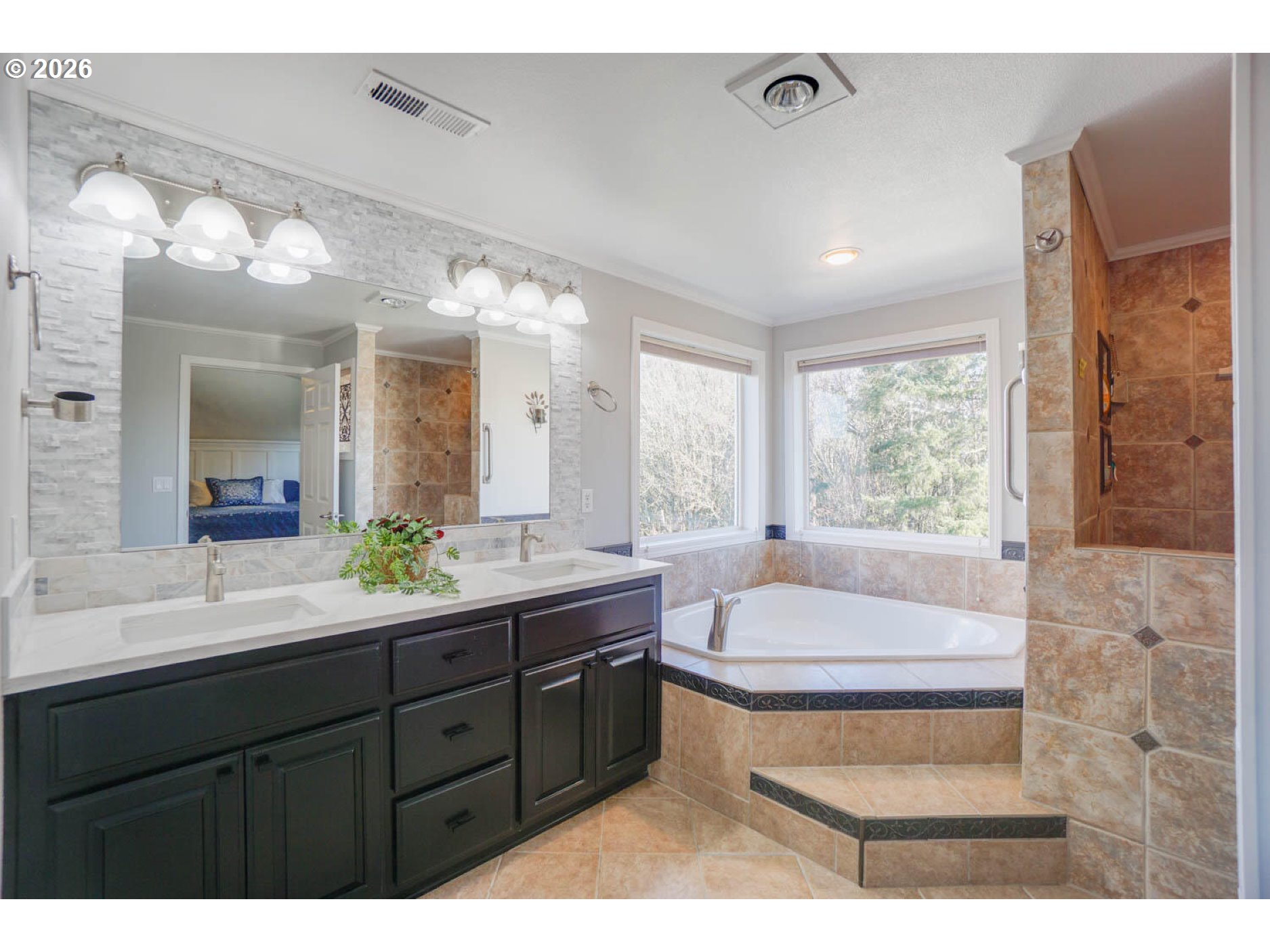 1612 North Heron Drive Ridgefield, WA 98642 - Photo 16 of 33 a bathroom with a tub sink and mirror