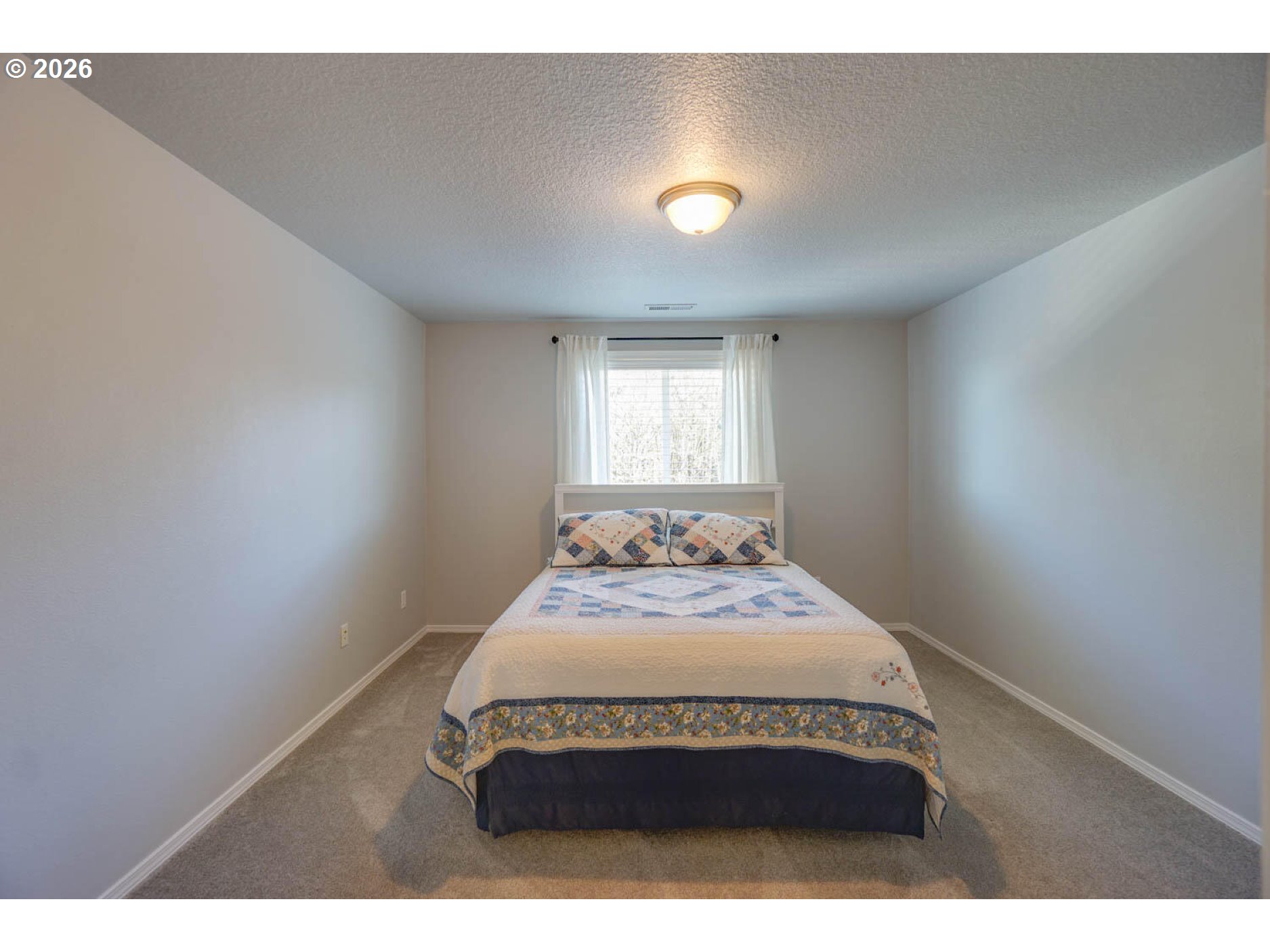 1612 North Heron Drive Ridgefield, WA 98642 - Photo 22 of 33 a bedroom with a bed and window