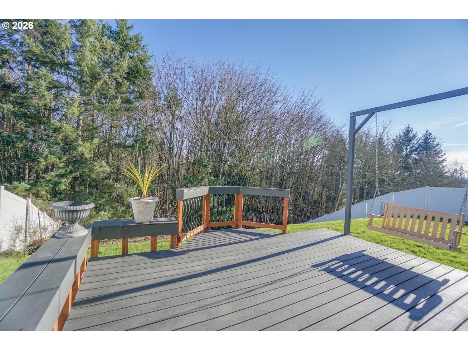 1612 North Heron Drive Ridgefield, WA 98642 - Photo 27 of 33 a view of a wooden deck with a bench