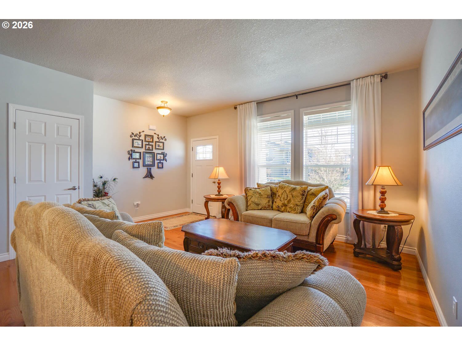 1612 North Heron Drive Ridgefield, WA 98642 - Photo 3 of 33 a living room with furniture and a large window
