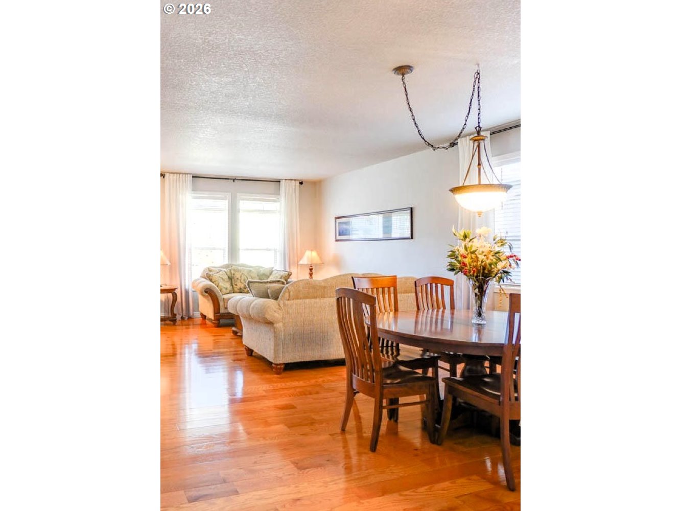 1612 North Heron Drive Ridgefield, WA 98642 - Photo 5 of 33 a dining room with furniture and wooden floor