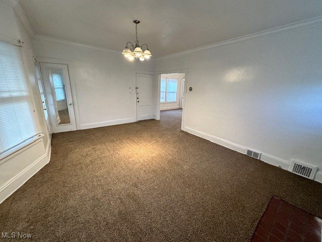 1612 Hillcrest Road Cleveland, OH 44118 - Photo 18 of 29 Spare room featuring ornamental molding, a chandelier, and dark colored carpet