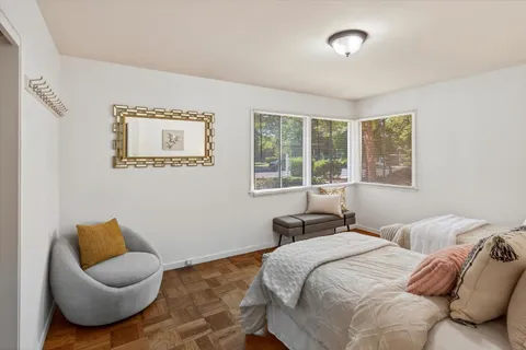 a bedroom with bed and a window