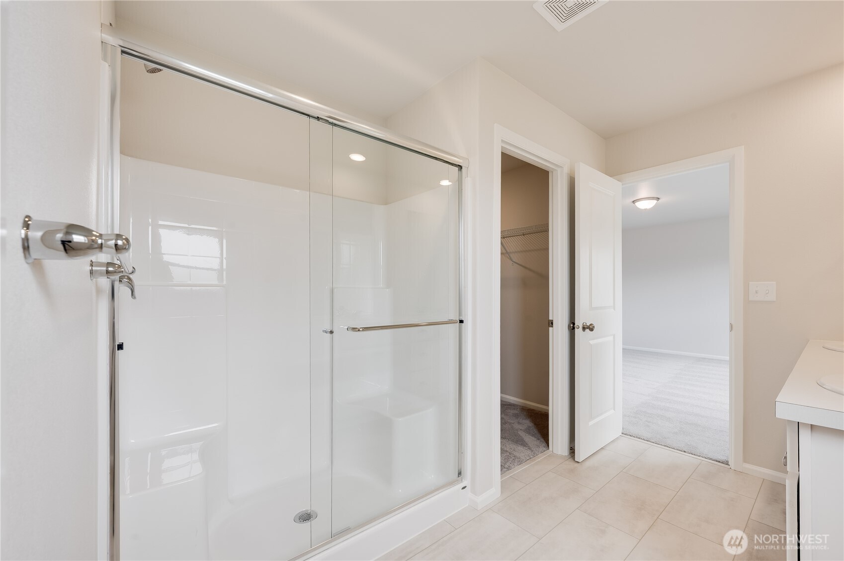 1012 15th Avenue Sultan, WA 98294 - Photo 12 of 26 a bathroom with a shower and a glass door