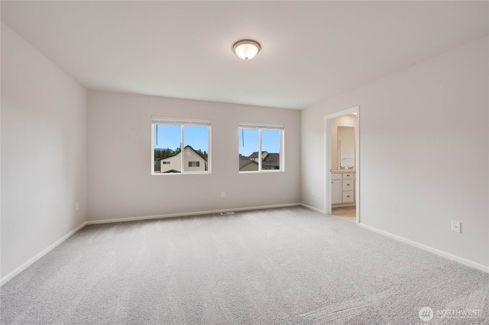 1012 15th Avenue Sultan, WA 98294 - Photo 18 of 26 an empty room with windows and closet