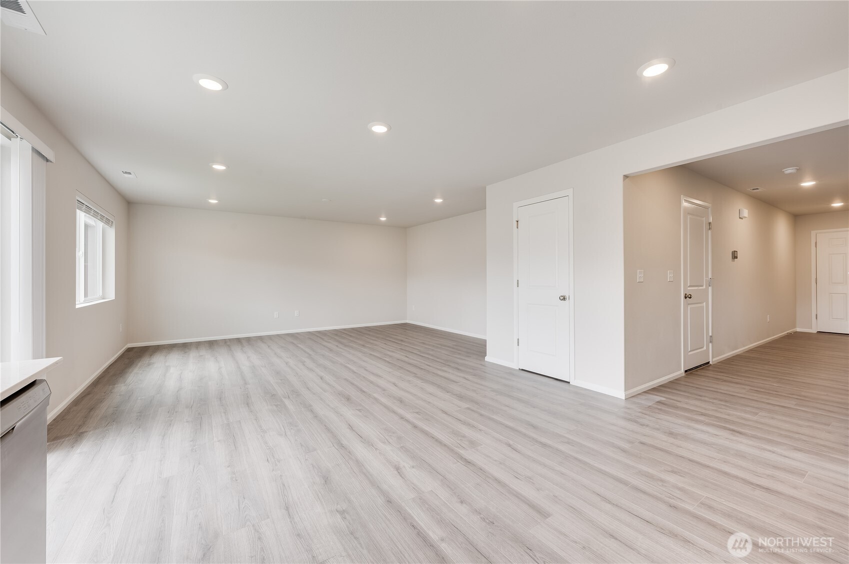 1012 15th Avenue Sultan, WA 98294 - Photo 10 of 26 a view of an empty room with wooden floor