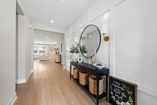 a view of a living room and wooden floor