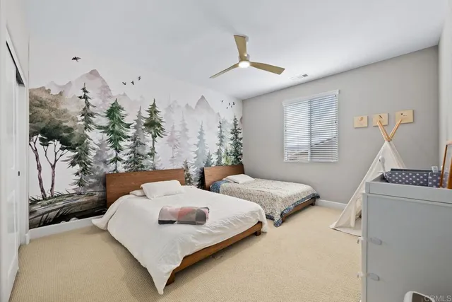 a bedroom with bed and window