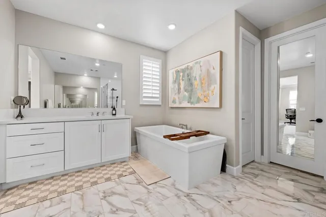 a kitchen with a sink stove and mirror
