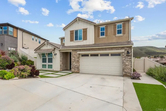 a front view of a house with a garage