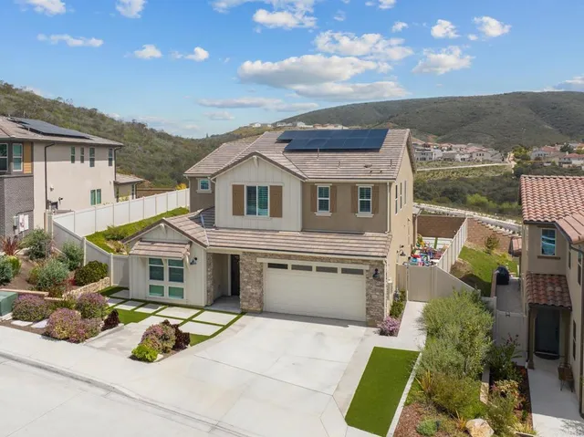 a view of house with yard