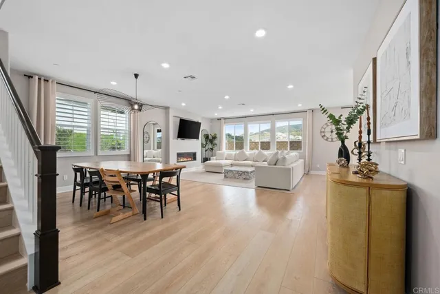 a view of a dining hall with furniture and wooden floor