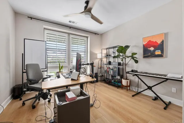 a view of a livingroom with furniture and a window