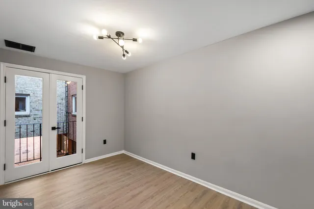 a view of a balcony with a floor to ceiling window