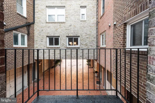 a kitchen with stainless steel appliances a refrigerator sink and microwave