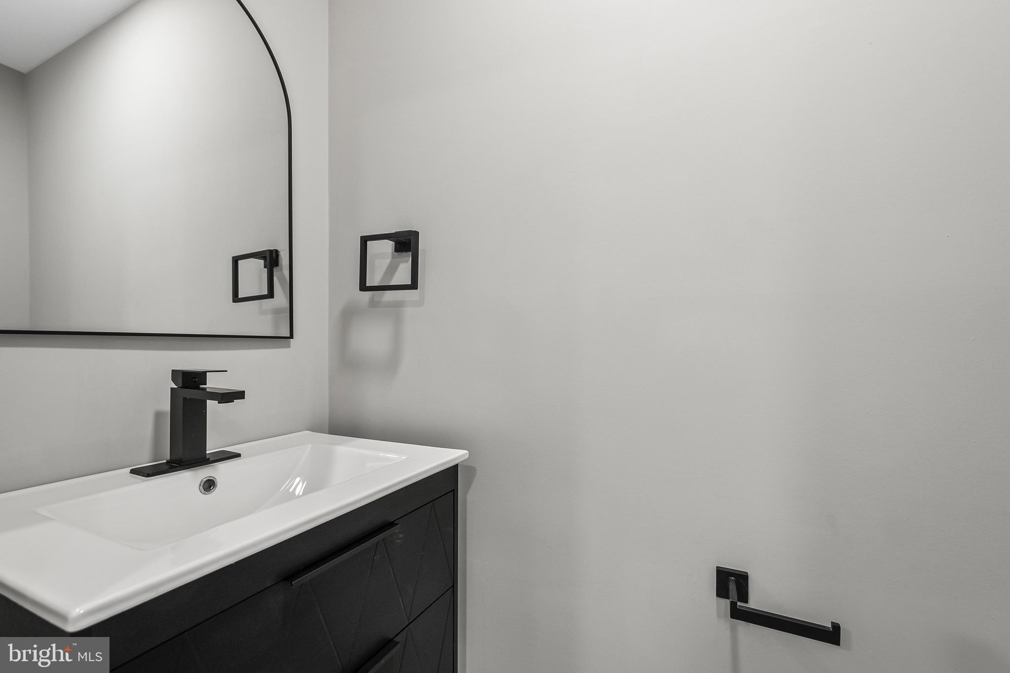 1527 North Colonial Terrace, Unit B Arlington, VA 22209 - Photo 17 of 28 a bathroom with a sink and mirror