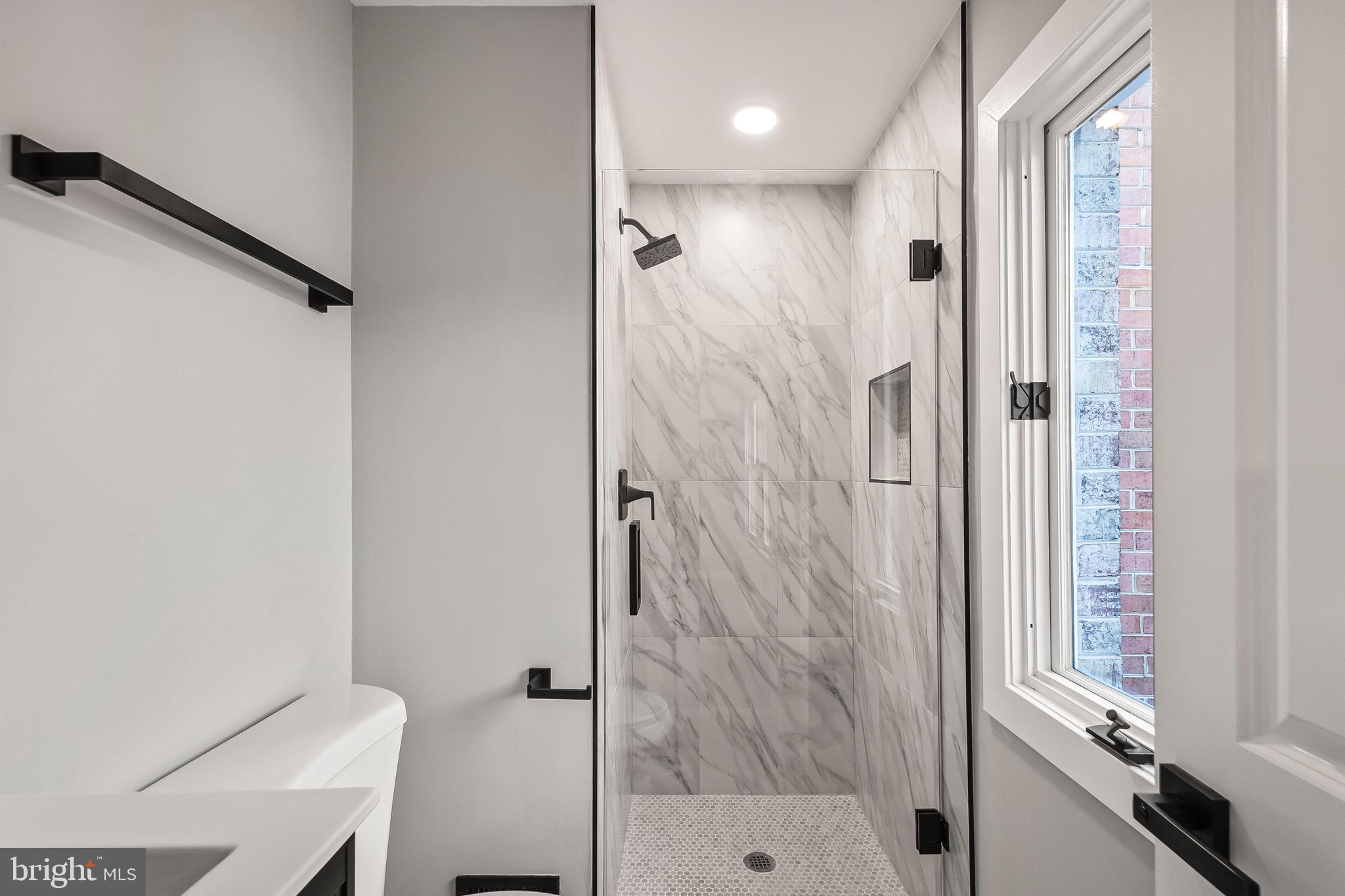 1527 North Colonial Terrace, Unit B Arlington, VA 22209 - Photo 22 of 28 a bathroom with a shower and a toilet