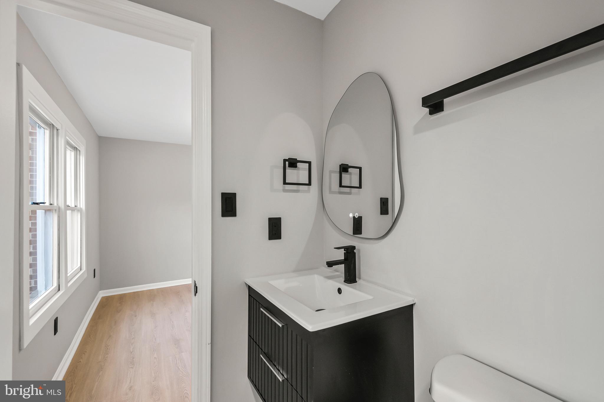 1527 North Colonial Terrace, Unit B Arlington, VA 22209 - Photo 23 of 28 a bathroom with a sink and mirror